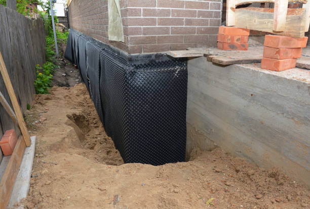 Happy homeowners after waterproofing job in Sneedville